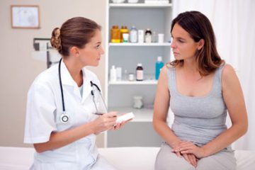Women's health doctor talking to patient about contraception